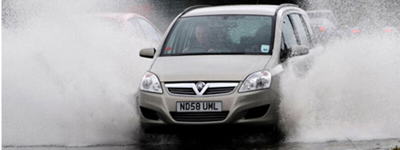 Car splashing water from both sides