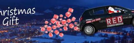 RED car flying in the sky with santa driving